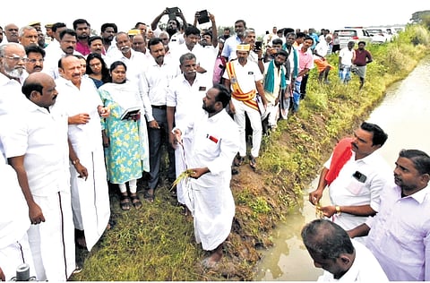 Minister for Agriculture and Farmers’ Welfare MRK Panneerselvam inspecting paddy crop at Ukkadai village in Thanjavur district on Thursday 