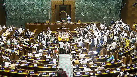 Opposition members protest in the Lok Sabha during the Winter session of Parliament, in New Delhi, Thursday, Nov. 28, 2024.