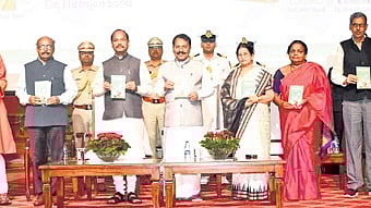 Governor Raghubar Das releasing the book in presence of his Goa counterpart PS Sreedharan Pillai and other dignitaries 