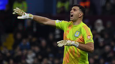 Aston Villa's goalkeeper Emiliano Martinez talks to his players during the Champions League opening phase soccer match between Aston Villa and Juventus at Villa Park in Birmingham, England.