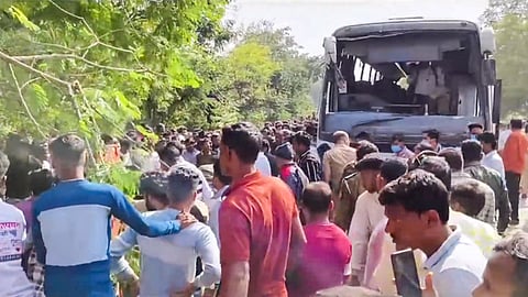 : People gather at the site after a Maharashtra State Road Transport Corporation (MSRTC) bus overturned, in Gondia district of Maharashtra, Friday, Nov. 29, 2024