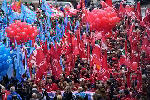 Demonstrators gather during a public and private sectors' national strike called by the labor unions to protest against government's budget law in Rome, Friday, Nov. 29, 2024.
