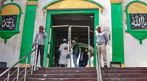 Devotees arrive at the Shahi Jama Masjid to offer prayers, in Sambhal, Friday, Nov. 29, 2024. 