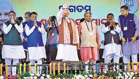 PM Narendra Modi waves at people during his reception in Bhubaneswar. Also seen are CM Mohan Majhi, Union minister Dharmendra Pradhan, state president Manmohan Samal & senior leaders