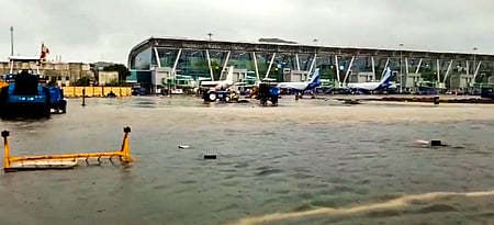 An area is seen inundated with rainwater at the airport amid heavy rainfall in Chennai on Saturday (Photo | PTI)
