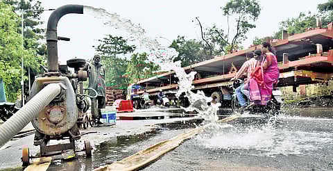 Water being pumped out near a road at Villivakkam on Sunday