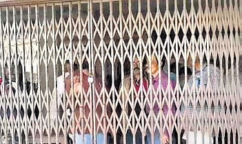 Students lock the institution's main gate in protest.
