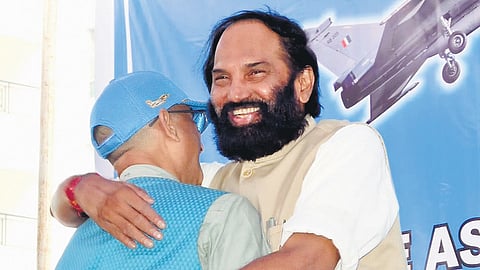 Irrigation Minister Uttam Kumar Reddy hugs an ex-serviceman at the Airforce Veterans Association meeting in Hyderabad on Sunday