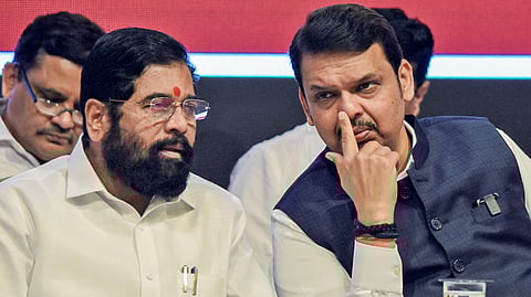 BJP leader Devendra Fadnavis (R) with Shiv Sena leader Eknath Shinde.