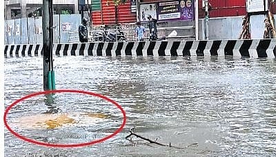 The manhole opposite Mullai bus stop at Vyasarpadi was left uncovered, leaving the drain open on a flooded road on Saturday.