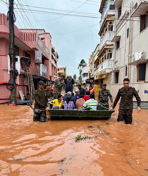 Indian Army personnel rescue people from a flooded area in the aftermath of landfall of Cyclone Fengal, in Puducherry.