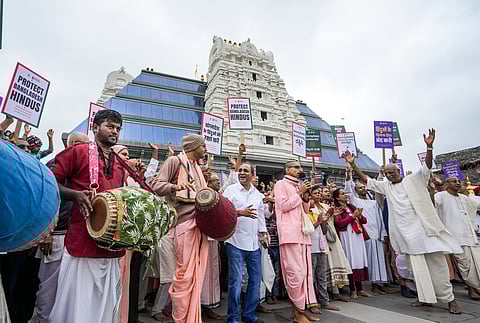 Members of the International Society for Krishna Consciousness (ISKCON) and devotees recite devotional songs during a protest against the arrest of Hindu spiritual leader Chinmoy Krishna Das in Bangladesh, in Bengaluru, Karnataka, Sunday, Dec. 1, 2024.