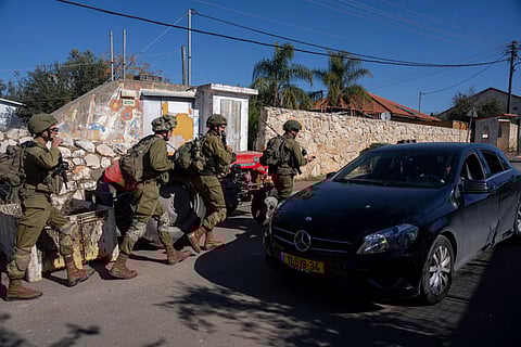 Israeli soldiers patrol the perimeter of the agricultural settlement of Avivim, next to the Lebanese border, in upper Galilee, Israel, Monday Dec. 2, 2024.