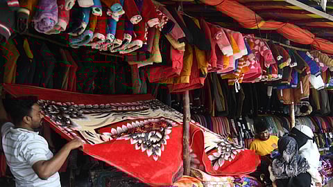 As winter arrives, a man is seen selling blankets at Koti in Hyderabad