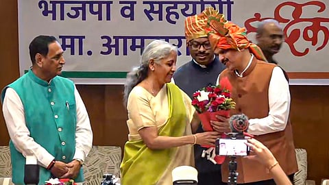 Union Finance Minister Nirmala Sitharaman felicitates BJP leader Devendra Fadnavis after he was unanimously elected as the Maharashtra BJP legislature party leader at its meeting, in Mumbai. BJP leaders Vijay Rupani and Chandrashekhar Bawankule are also seen.