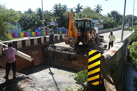 PWD men at work to restore the collapsed bridge