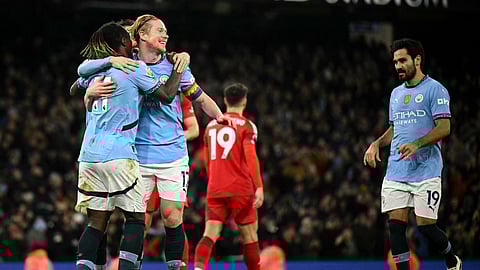 Manchester City's Belgian midfielder #17 Kevin De Bruyne celebrates scoring the team's second goal with Manchester City's Belgian midfielder #11 Jeremy Doku (L) during the EPL football match between Manchester City and Nottingham Forest