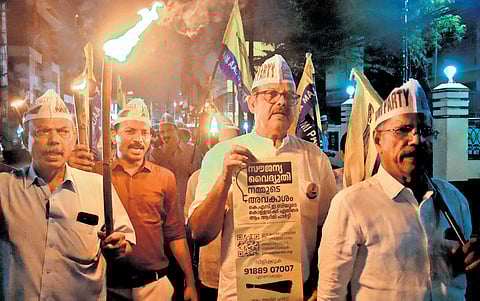Aam Aadmi Party workers take out a protest march to the KSEB office at Palarivattom in Kochi on Friday against power tariff hike.