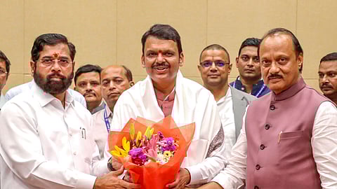 Maharashtra Chief Minister Devendra Fadnavis being felicitated by Deputy CMs Eknath Shinde and Ajit Pawar at the Cabinet meeting, in Mumbai, Thursday, Dec. 5, 2024.