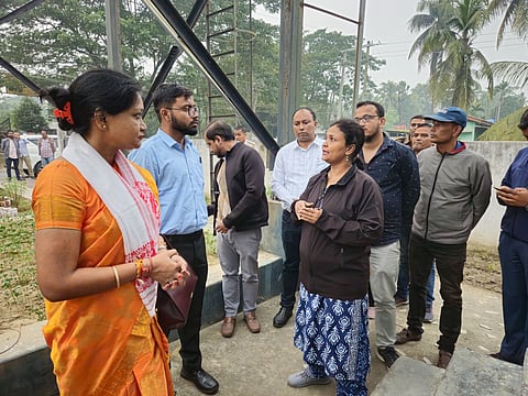 The civil services aspirant Mrinmoy Kalita (bearded, wearing sky blue shirt) is seen with Nalbari District Magistrate Varnali Deka (wearing an orange saree)