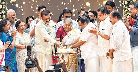 Sharada cutting her birthday cake along with Union Minister Suresh Gopi, CPM leader E P Jayarajan and other political and cultural leaders.