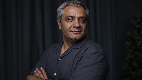 Director Mohammad Rasoulof poses for a portrait photograph for the film "The Seed of the Sacred Fig" at the 77th international film festival, Cannes, southern France, on May 23, 2024.