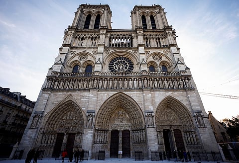 People stand outside Notre-Dame Cathedral in Paris, on Nov. 29 2024.