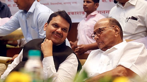 Maharashtra Chief Minister Devendra Fadnavis (L) with NCP (SP) chief Sharad Pawar.