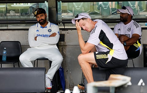 A disappointed Rohit Sharma (l) with bowling coach Morne Morkel (c) on Sunday 