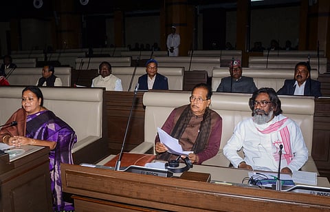 Jharkhand Chief Minister Hemant Soren with state Finance Minister Radhakrishna Kishore and other MLAs during the first day of the state Legislative Assembly session, in Ranchi, Monday, Dec. 9, 2024.