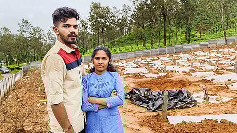 Shruti, with fiance Jaison at the Puthumala graveyard where some of her family memebers who died in the landslide were buried. 