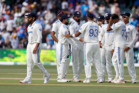India's captain Rohit Sharma, left, walks off the field as his teammates greet each other after their loss in the second cricket test match against Australia at the Adelaide Oval in Adelaide, Australia, Sunday, Dec. 8, 2024.