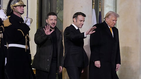 French President Emmanuel Macron, center, President-elect Donald Trump, right, and Ukraine's President Volodymyr Zelenskyy leave after their meeting at the Elysee Palace, Saturday, Dec. 7, 2024 in Paris.