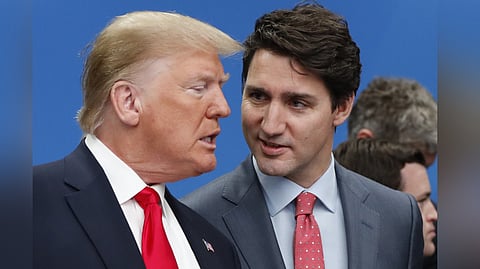 Then US President Donald Trump (L) and Canadian Prime Minister Justin Trudeau (R) talk prior to a NATO round table meeting in Watford, England, Dec. 4, 2019.
