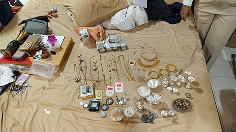 Jewels and cash seized from the residence of an official during a raid by Lokayukta police on Tuesday