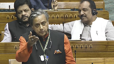 Congress MP Shashi Tharoor speaks in the Lok Sabha during the Winter session of Parliament, in New Delhi