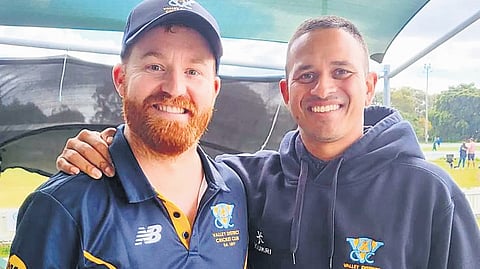 Usman Khawaja with former teammate Andrew Gode