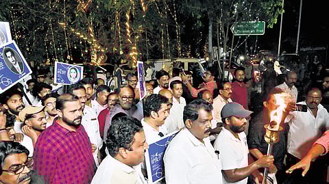 MLA Antony Raju and Chalachithra Academy chairman Prem Kumar join the torchlight procession from Neyyattinkara to Manaveeyam Veedhi on the eve of the beginning of the 29th International Film Festival of Kerala, on Thursday.