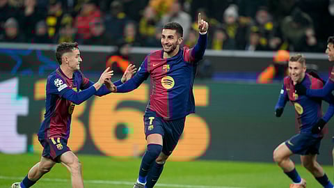 Barcelona's Ferran Torres celebrates his side's second goal during the Champions League opening phase football match between Borussia Dortmund and FC Barcelona at the Signal-Iduna Park in Dortmund, Germany.
