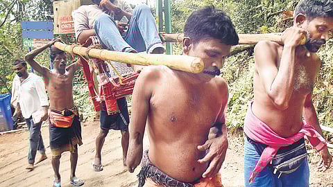 Alex on the way to Sannidhanam from Pampa during a regular trip carrying a devotee with health issues on a dolly.