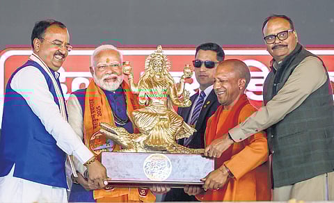 PM Narendra Modi being felicitated by Uttar Pradesh CM Yogi Adityanath and Deputy CMs Keshav Prasad Maurya and Brajesh Pathak during the inauguration of development projects for the 2025 Mahakumbh in Prayagraj on Friday.