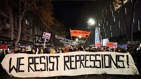 Anti-government demonstrators protest against the Georgian government's postponement of European Union accession talks until 2028 in central Tbilisi on December 13, 2024.