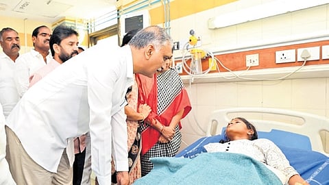 Former minister T Harish Rao consoles food poisoning victim undergoing treatment at NIMS on Saturday