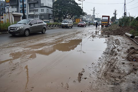 Roads digged out for UGD works are turned into a sludge fields as the officials are yet to repair the damaged tiruchy road near Ondipudhur in Coimbatore on Friday. 