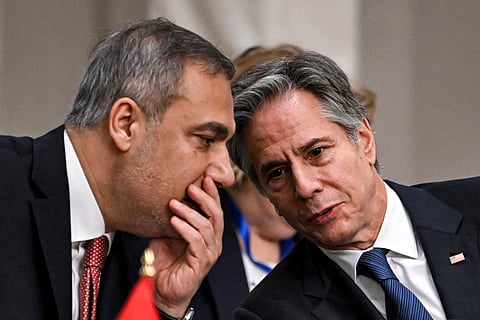 Turkey's Foreign Minister Hakan Fidan, left, speaks with US Secretary of State Antony Blinken during a meeting with the foreign ministers of the Arab Contact Group on Syria in Jordan's southern Red Sea coastal city of Aqaba, Saturday Dec. 14, 2024.