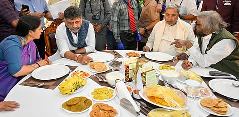 Chief Minister Siddaramaiah, Deputy Chief Minister DK Shivakumar and other ministers eat together at Suvarna Vidhana Soudha in Belagavi on Friday.