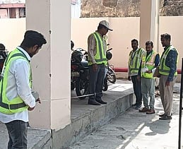 HAML officials taking measurements for calculating structural compensation in Hyderabad for the Old City Metro.