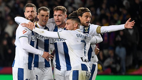 Leganes players celebrate victory at the end of the Spanish league football match between FC Barcelona and Club Deportivo Leganes SAD at the Estadi Olimpic Lluis Companys in Barcelona.