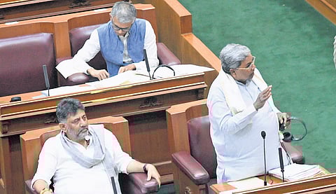 Chief Minister Siddaramaiah addresses the Assembly, as Deputy Chief Minister DK Shivakumar and Revenue Minister Krishna Byregowda look on, in Belagavi on Monday