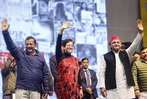 Delhi Chief Minister Atishi, centre, with AAP National Convener Arvind Kejriwal, left, and Samajwadi Party President Akhilesh Yadav during the 'Mahila Adalat' (Photo | PTI)